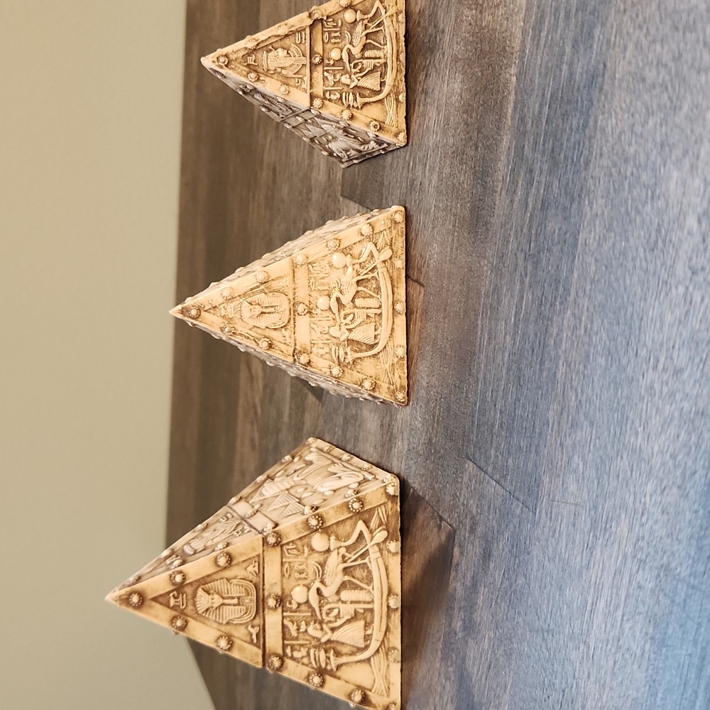 Carved Egyptian pyramid figurines